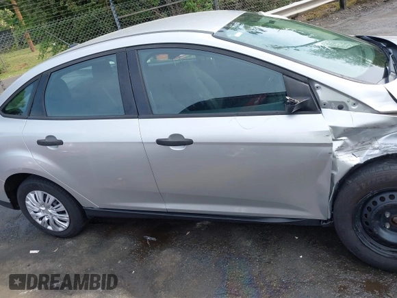 2017 Ford Focus S z VIN 1FADP3E21HL241557, wystawiony jako IAAI lot #42100036 z przebiegiem 106 764 mil mil oraz . Historia ofert i sprzedaży dostępna na DreamBid. Obrazek 13.