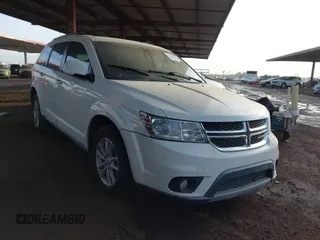2013 Dodge Journey SXT with VIN 3C4PDCBG0DT701676, listed as a IAAI auction lot 41214275 with 144,196 mi miles. Bid and sale history available at carsss.com. Image 1.