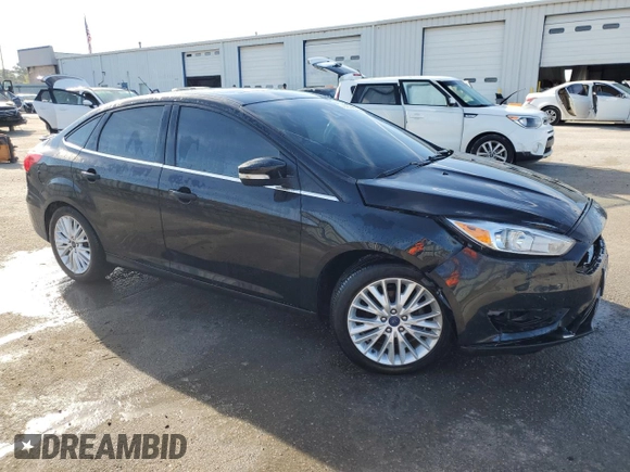 2016 Ford Focus Titanium with VIN 1FADP3J22GL201721, listed as a Copart auction lot 50633795 with 29,801 mi miles and Salvage title. Bid and sale history available at DreamBid. Image 4.