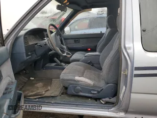 1991 Toyota Pickup DLX z VIN JT4VN13GXM5041525, wystawiony jako Copart lot #80709474 z przebiegiem 309 094 mil mil oraz Szkoda całkowita • Salvage title. Historia ofert i sprzedaży dostępna na DreamBid. Obrazek 7.