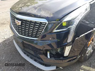 2021 Cadillac XT5 AWD Premium Luxury z VIN 1GYKNDRS8MZ217572, wystawiony jako IAAI lot #42190571 z przebiegiem 25 100 mil mil oraz . Historia ofert i sprzedaży dostępna na DreamBid. Obrazek 6.