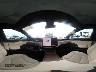 2021 Tesla Model S Long Range with VIN 5YJSA1E57MF453815, listed as a IAAI auction lot 41818700 with 51,176 mi miles and . Bid and sale history available at DreamBid. Image 21.