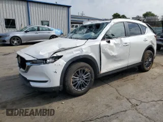 2021 Mazda CX-5 Touring with VIN JM3KFACM1M0405129, listed as a Copart auction lot 67874724 with 49,618 mi miles and Salvage Title. Bid and sale history available at carsss.com. Image 1.