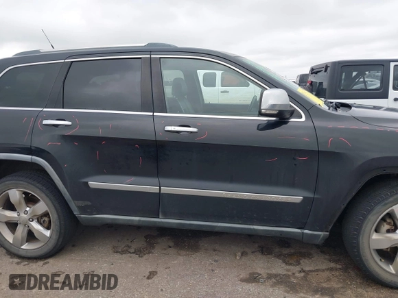 2011 Jeep Grand Cherokee Overland with VIN 1J4RS6GT7BC518123, listed as a IAAI auction lot 41277374 with 163,752 mi miles and . Bid and sale history available at DreamBid. Image 13.