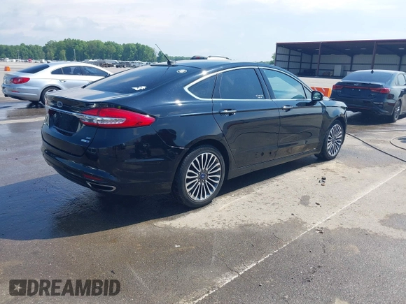 2017 Ford Fusion SE with VIN 3FA6P0T94HR321704, listed as a IAAI auction lot 42253691 with 129,115 mi miles and . Bid and sale history available at DreamBid. Image 4.