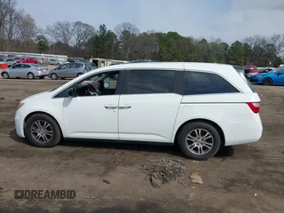 2011 Honda Odyssey EX-L with VIN 5FNRL5H67BB070541, listed as a IAAI auction lot 41812554 with 150,898 mi miles and . Bid and sale history available at DreamBid. Image 14.