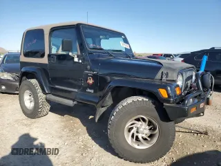 1999 Jeep Wrangler Sahara with VIN 1J4FY49S9XP479545, listed as a Copart auction lot 54753745 with 34,642 mi miles and Salvage title. Bid and sale history available at DreamBid. Image 4.