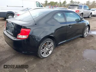 2011 Scion tC with VIN JTKJF5C74B3014552, listed as a IAAI auction lot 42004369 with 232,588 mi miles. Bid and sale history available at carsss.com. Image 4.