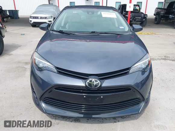 2018 Toyota Corolla L with VIN 5YFBURHE8JP770696, listed as a IAAI auction lot 42386025 with 63,224 mi miles and . Bid and sale history available at DreamBid. Image 12.