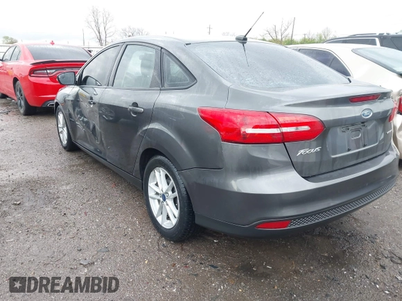 2015 Ford Focus SE with VIN 1FADP3F28FL219552, listed as a IAAI auction lot 41959648 with 128,590 mi miles. Bid and sale history available at carsss.com. Image 3.