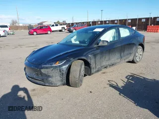 2025 Tesla Model 3 Long Range with VIN 5YJ3E1EB5SF877778, listed as a IAAI auction lot 41639595 with 8,295 mi miles and . Bid and sale history available at DreamBid. Image 2.
