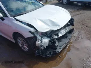 2025 Toyota Camry LE with VIN 4T1DAACK6SU082583, listed as a IAAI auction lot 42233444 with 18,935 mi miles and . Bid and sale history available at DreamBid. Image 6.