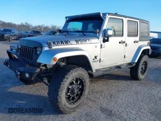 2010 Jeep Wrangler Unlimited Sahara with VIN 1J4BA5H14AL230604, listed as a IAAI auction lot 41884346 with 97,060 mi miles. Bid and sale history available at carsss.com. Image 17.