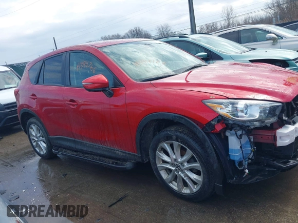 2015 Mazda CX-5 Grand Touring with VIN JM3KE4DY7F0477770, listed as a IAAI auction lot 41617849 with 106,135 mi miles. Bid and sale history available at carsss.com. Image 14.