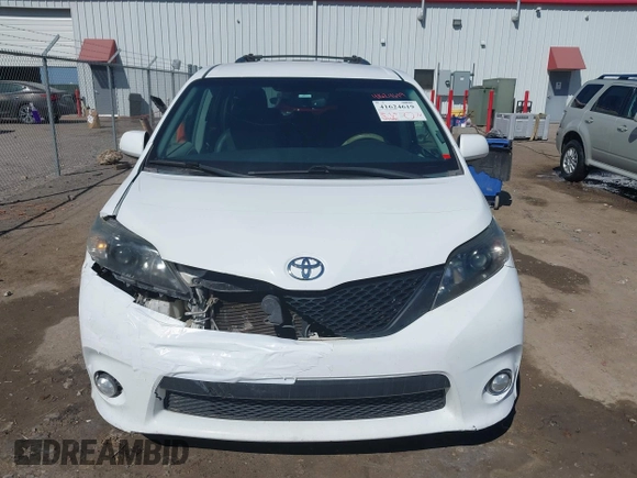 2014 Toyota Sienna SE with VIN 5TDXK3DC0ES477207, listed as a IAAI auction lot 41624619 with 213,881 mi miles and . Bid and sale history available at DreamBid. Image 12.