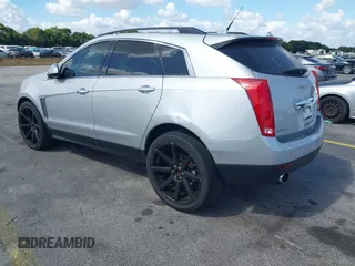 2013 Cadillac SRX z VIN 3GYFNAE32DS512534, wystawiony jako IAAI lot #41596602 z przebiegiem 193 131 mil mil oraz . Historia ofert i sprzedaży dostępna na DreamBid. Obrazek 3.