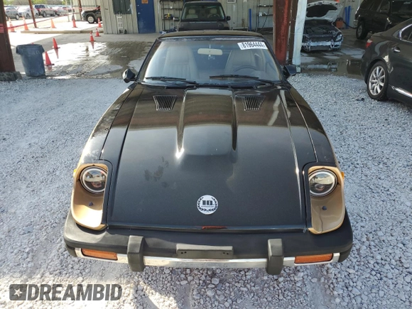 1980 Datsun 280ZX z VIN HS130221335, wystawiony jako Copart lot #81964444 z przebiegiem 135 266 mil mil oraz Szkody całkowita. Historia ofert i sprzedaży dostępna na DreamBid. Obrazek 5.