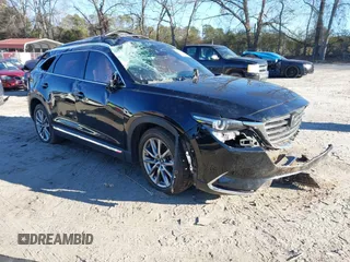 2018 Mazda CX-9 Grand Touring z VIN JM3TCADY5J0204845, wystawiony jako IAAI lot #41292695 z przebiegiem 98 751 mil mil oraz . Historia ofert i sprzedaży dostępna na DreamBid. Obrazek 1.