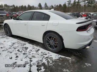 2019 Dodge Charger SXT with VIN 2C3CDXJG6KH730441, listed as a Copart auction lot 87877955 with 50,892 mi miles and Salvage Title. Bid and sale history available at DreamBid. Image 2.