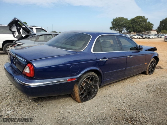 2004 Jaguar XJ with VIN SAJWA71C34SG19800, listed as a Copart auction lot 71877194 with 157,051 mi miles and Salvage Title. Bid and sale history available at carsss.com. Image 3.