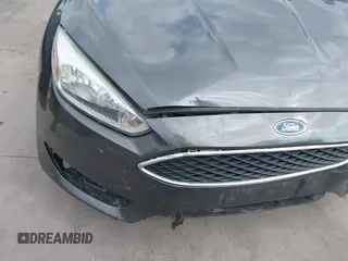 2018 Ford Focus SE with VIN 1FADP3F22JL295342, listed as a IAAI auction lot 42335881 with 77,464 mi miles and . Bid and sale history available at DreamBid. Image 6.