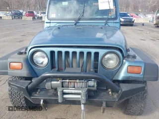 1997 Jeep Wrangler SE with VIN 1J4FY29P0VP522005, listed as a IAAI auction lot 41895863 with 196,614 mi miles. Bid and sale history available at carsss.com. Image 6.