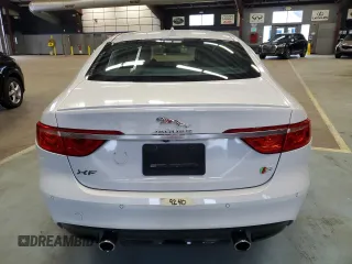 2016 Jaguar XF S with VIN SAJBG4BV0GCY00411, listed as a Copart auction lot 66068964 with 94,983 mi miles and Salvage Title. Bid and sale history available at carsss.com. Image 6.