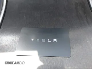 2020 Tesla Model 3 Standard Range Plus with VIN 5YJ3E1EA1LF659765, listed as a IAAI auction lot 41834411 with 42,433 mi miles and . Bid and sale history available at carsss.com. Image 11.