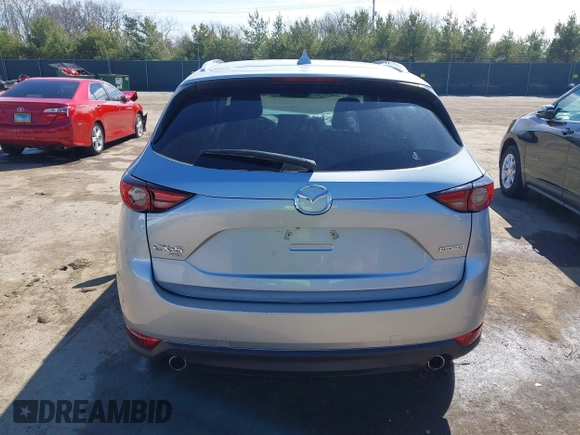2021 Mazda CX-5 Grand Touring with VIN JM3KFBDM3M1300316, listed as a IAAI auction lot 41878520 with 77,670 mi miles and . Bid and sale history available at DreamBid. Image 16.
