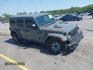 2020 Jeep Wrangler Unlimited Rubicon z VIN 1C4HJXFN4LW335890, wystawiony jako IAAI lot #42063005 z przebiegiem 34 701 mil mil oraz . Historia ofert i sprzedaży dostępna na DreamBid. Obrazek 1.
