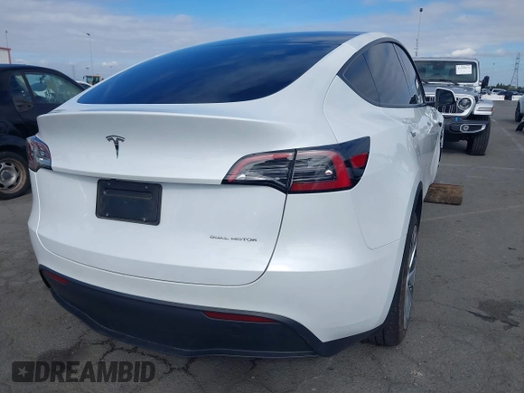 2023 Tesla Model Y Long Range with VIN 7SAYGDEE9PA094191, listed as a IAAI auction lot 41906319 with 15,240 mi miles and . Bid and sale history available at DreamBid. Image 4.