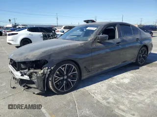 2023 BMW 5 Series M550i xDrive with VIN WBA13BK04PCM97306, listed as a Copart auction lot 76813754 with 19,259 mi miles and Salvage title. Bid and sale history available at DreamBid. Image 1.