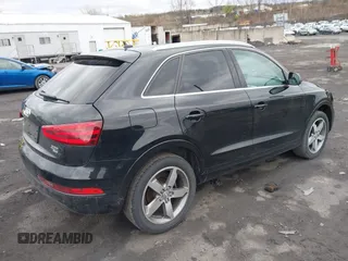 2015 Audi Q3 Premium Plus z VIN WA1EFCFS6FR012425, wystawiony jako IAAI lot #42042484 z przebiegiem 139 012 mil mil oraz . Historia ofert i sprzedaży dostępna na DreamBid. Obrazek 4.