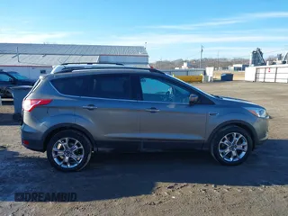 2014 Ford Escape SE z VIN 1FMCU9GXXEUB99093, wystawiony jako IAAI lot #41662040 z przebiegiem 120 783 mil mil oraz . Historia ofert i sprzedaży dostępna na DreamBid. Obrazek 14.