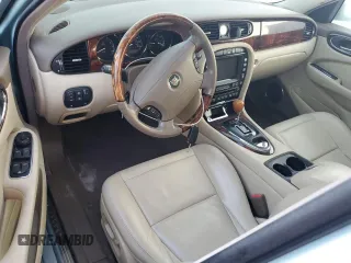 2005 Jaguar XJ with VIN SAJWA79C05SG37189, listed as a Copart auction lot 76804104 with 0 mi miles and Salvage Title. Bid and sale history available at carsss.com. Image 8.