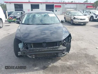 2014 Volkswagen Passat S z VIN 1VWAT7A30EC041728, wystawiony jako IAAI lot #42102295 z przebiegiem 94 768 mil mil oraz . Historia ofert i sprzedaży dostępna na DreamBid. Obrazek 13.
