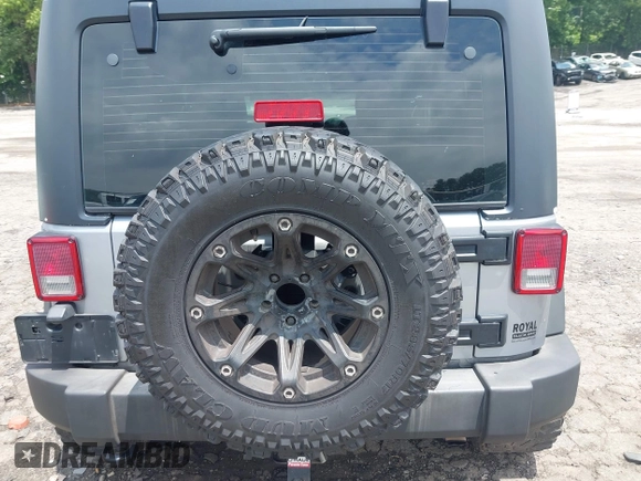 2016 Jeep Wrangler Black Bear with VIN 1C4AJWAG5GL258426, listed as a IAAI auction lot 42400914 with 128,606 mi miles and . Bid and sale history available at DreamBid. Image 16.