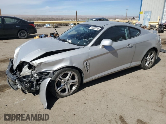 2006 Hyundai Tiburon GT z VIN KMHHN65F76U190851, wystawiony jako Copart lot #45935795 z przebiegiem 102 335 mil mil oraz Szkoda całkowita • Salvage title. Historia ofert i sprzedaży dostępna na DreamBid. Obrazek 1.