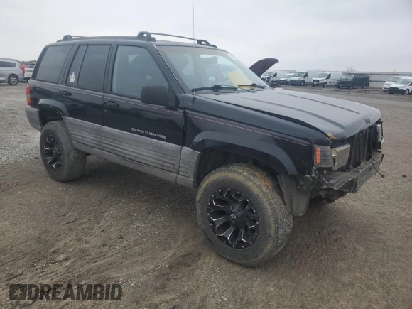 1998 Jeep Grand Cherokee Laredo with VIN 1J4GZ58S2WC281923, listed as a Copart auction lot 44010885 with 210,959 mi miles and Salvage Title. Bid and sale history available at carsss.com. Image 4.