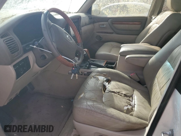 2002 Lexus LX 470 z VIN JTJHT00W623517039, wystawiony jako Copart lot #51458785 z przebiegiem 219 906 mil mil oraz Tytuł czysty. Historia ofert i sprzedaży dostępna na DreamBid. Obrazek 7.