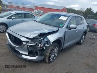 2021 Mazda CX-5 Grand Touring with VIN JM3KFBDM3M0354348, listed as a IAAI auction lot 41924207 with 45,786 mi miles. Bid and sale history available at carsss.com. Image 2.