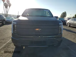 2023 Ford F-150 Lightning Pro with VIN 1FTVW1EL7PWG11261, listed as a Copart auction lot 64088925 with 3,288 mi miles and Salvage title. Bid and sale history available at DreamBid. Image 5.