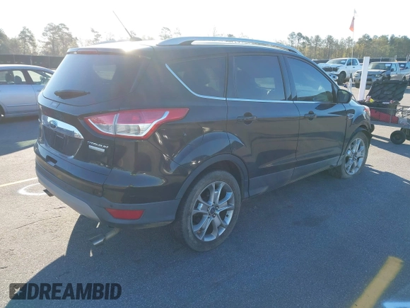 2016 Ford Escape Titanium with VIN 1FMCU0JX3GUA90420, listed as a IAAI auction lot 41850537 with 115,770 mi miles. Bid and sale history available at carsss.com. Image 4.
