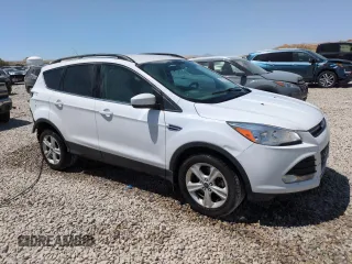 2014 Ford Escape SE with VIN 1FMCU9GX1EUE26459, listed as a Copart auction lot 60756805 with 174,945 mi miles and Salvage title. Bid and sale history available at DreamBid. Image 4.