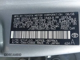 2009 Toyota Yaris with VIN JTDBT903X91301963, listed as a IAAI auction lot 42102283 with 143,966 mi miles. Bid and sale history available at carsss.com. Image 9.