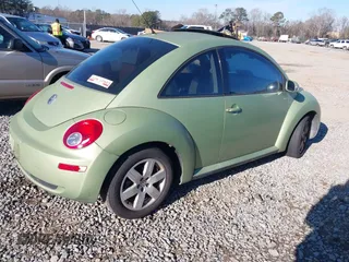 2007 Volkswagen New Beetle Coupe with VIN 3VWRW31C57M519484, listed as a IAAI auction lot 41291687 with 203,516 mi miles. Bid and sale history available at carsss.com. Image 4.