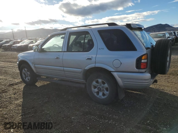 1999 Isuzu Rodeo S z VIN 4S2CM58W8X4339006, wystawiony jako Copart lot #84285294 z przebiegiem 129 191 mil mil oraz Czysty tytuł • Clean title. Historia ofert i sprzedaży dostępna na DreamBid. Obrazek 2.