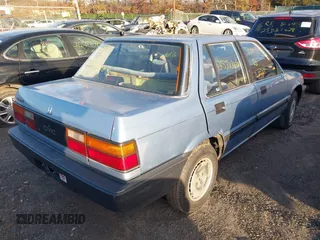 1986 Honda Civic z VIN JHMAK7439GS063929, wystawiony jako IAAI lot #41594413 z przebiegiem Nie podano mil oraz . Historia ofert i sprzedaży dostępna na DreamBid. Obrazek 4.