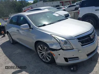 2016 Cadillac XTS Luxury Collection z VIN 2G61M5S37G9106316, wystawiony jako IAAI lot #42325865 z przebiegiem 236 000 mil mil oraz . Historia ofert i sprzedaży dostępna na DreamBid. Obrazek 1.