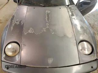 1984 Porsche 928 z VIN WP0JB0925ES861303, wystawiony jako Copart lot #41979575 z przebiegiem 114 593 mil mil oraz Nie do naprawy. Historia ofert i sprzedaży dostępna na DreamBid. Obrazek 11.